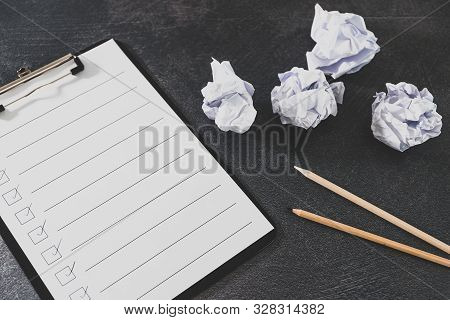 Overcoming Lack Of Productivity Concept, To Do List On Clipboard And Pencil Next To Scrunched Papers