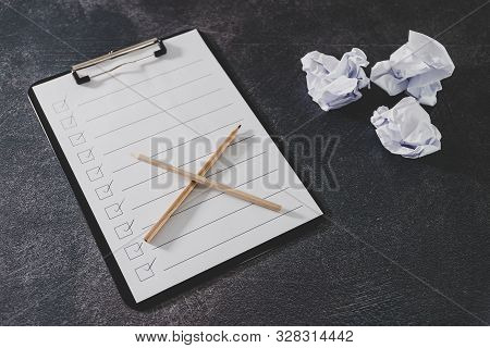 Overcoming Lack Of Productivity Concept, To Do List On Clipboard And Pencil Next To Scrunched Papers