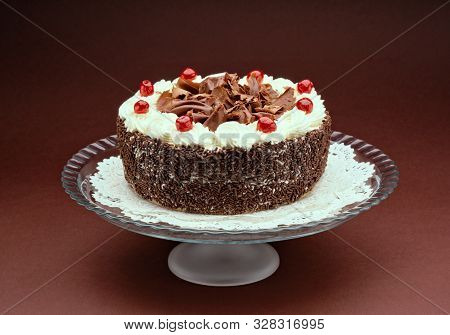 A Cioccolate Cake On A Glass Tray