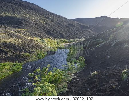 Icelandic Landscape With Blue River Stream And Lush Green Vegatation At Iceland On Laugavegur Hiking