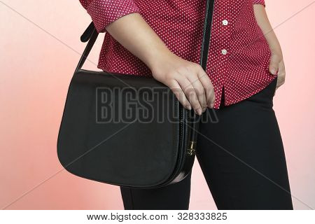 Young Fachionable Stylish Glamour Woman Wearing Red Polka Dot Shirt And Black Trousers Hanging Black