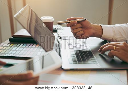 Business Partnership Pointing To The Graph Of The Company Financial Statements Report And Profits Ea