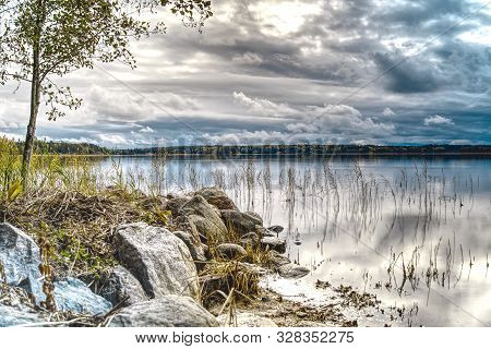 Pleasant Landscape, Nature, Sea View. The Sky In Thick Rain Clouds, The Rocky Shore And The Baltic S