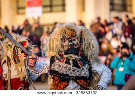 Mummers perform rituals to scare evil spirits at Surva festival at Pernik in Bulgaria. The people with the masks are called Kuker (kukeri). Mask from wool.