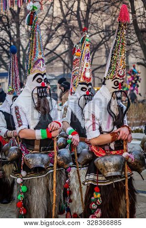 Mummers perform rituals to scare evil spirits at Surva festival at Pernik in Bulgaria. The people with the masks are called Kuker (kukeri). Motley mask.