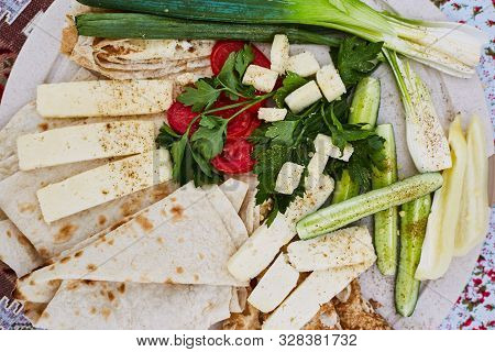 Pita Bread With Tomatoes, Cucumbers. Unleavened White Bread. National Cuisine Of The Peoples Of The 