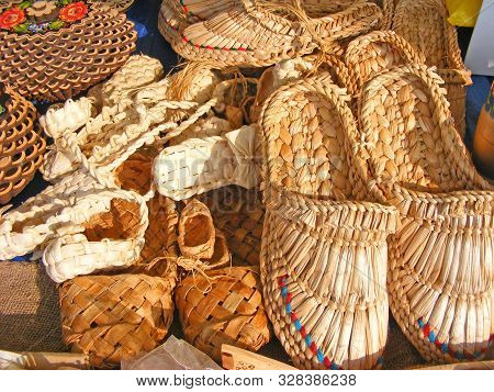 Collection Of Traditional Bast Shoes Hanging Close Up