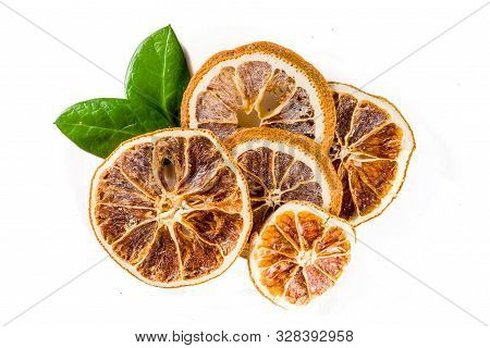 Heap Of Sun Dried Orange Slices Isolated On White Background. Top View