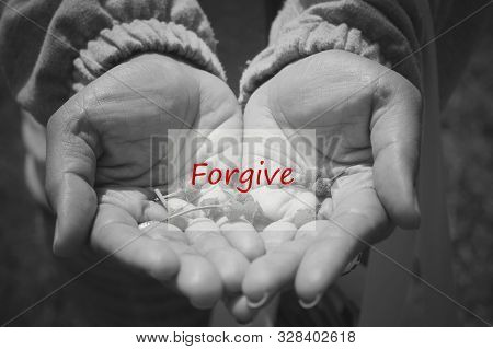 Inspirational Word - Forgive In An Open Hand In Black And White Background. Forgiveness, Freedom And