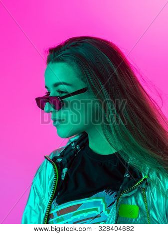 Young Stylish Girl Dancing In The Studio On A Colored Neon Background. Music Poster Design.