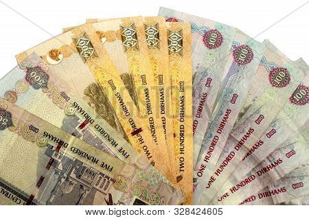 Uae National Currency, Top View Of Dirhams Banknotes On White Background. Dirhams