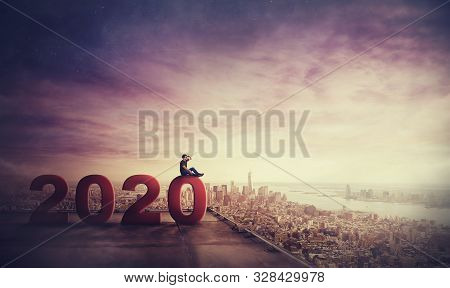 Man Waiting For Success Sitting On The Rooftop Of A Skyscraper Looking Over City Horizon, 2020 Big N