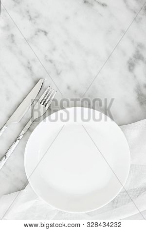 Empty Plate, Cutlery On Grey Stone Table And Napkin. Food Background For Menu, Recipe. Table Setting