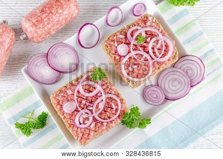 German Food Mett Ground Pork, Bun And Raw Meat With Onion And Parsley
