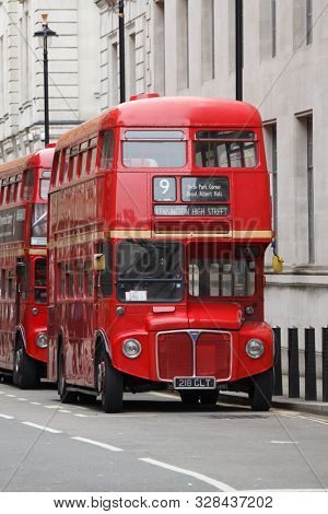 LONDON, UK - OCT 28, 2012: Iconic red AEC Routemaster  double-decker buses parked on a street in Central London
