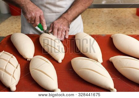 Cut Into The Bread Of The Already Fermented Bread Before It Goes Into The Oven