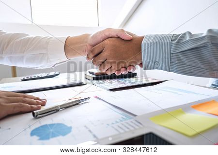 Finishing Up A Meeting Collaboration, Handshake Of Two Business People After Contract Agreement To B