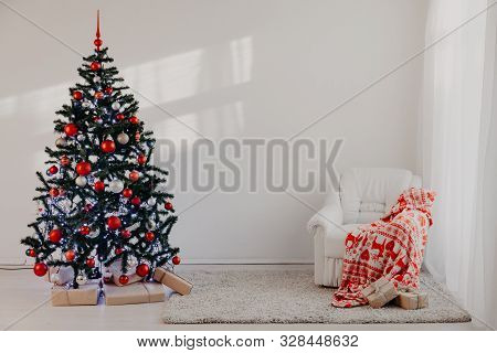 Christmas Tree In A White Room For Christmas With Gifts