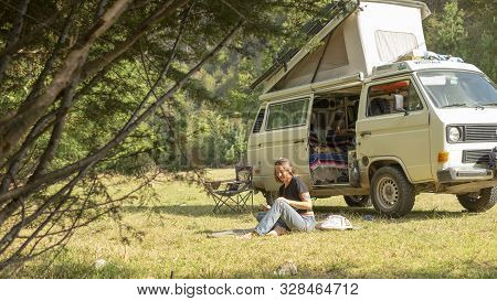 Encuentro Park, Chiapas, Mexico - April13th , 2018: Girl On The Park Beside A Classic Camper Van