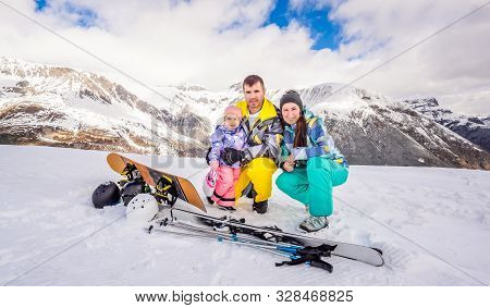 Happy Family, Male, Female And Child On Ski And Snowboard Holidays, Snow And Winter In Mountains, Fa