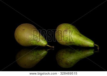 Group Of Two Whole Arranged Fresh Green Pear Isolated On Black Glass