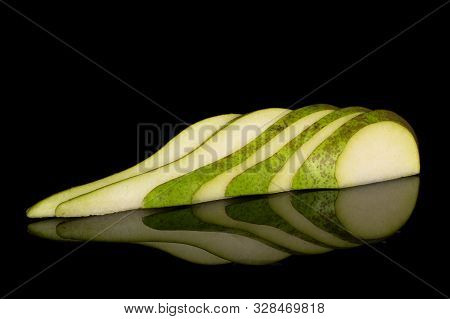 Group Of Five Slices Of Fresh Green Pear Isolated On Black Glass