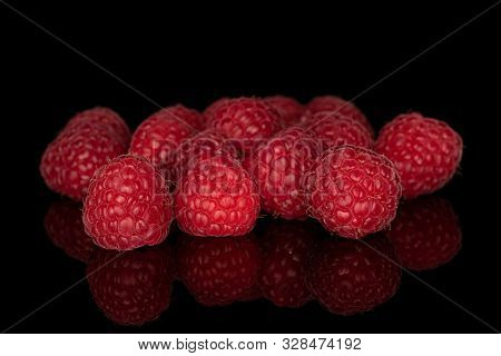 Lot Of Whole Fresh Red Raspberry Heap Isolated On Black Glass