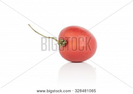 One Whole Red Fresh Tomato De Barao With Stem Isolated On White Background
