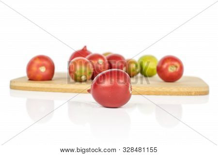Lot Of Whole Fresh Tomato De Barao One In Front On Bamboo Cutting Board Isolated On White Background