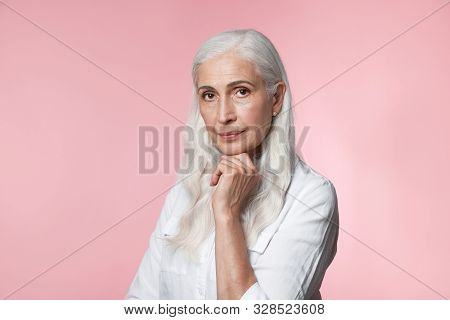 Portrait Of Beautiful Mature Woman On Pink Background