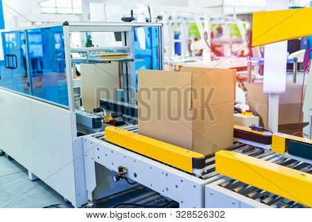 boxes in the cells of the automated warehouse. Metal construction warehouse shelving