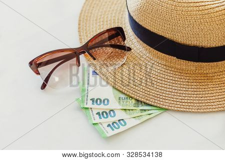 Sun Hat With Sunglasses And 100 Hundredth Euro Banknotes. Money Or Vacation Concept