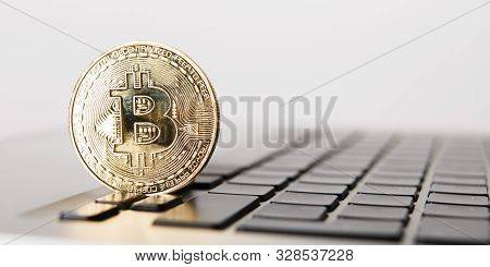 Golden Bitcoin - New Virtual Money On Notebook. A Visual Representation Of Digital Cryptocurrencies.