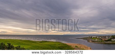 Brora / Scotland - August 28, 2019: Houses At Sunrise On The North Sea Shore In Brora