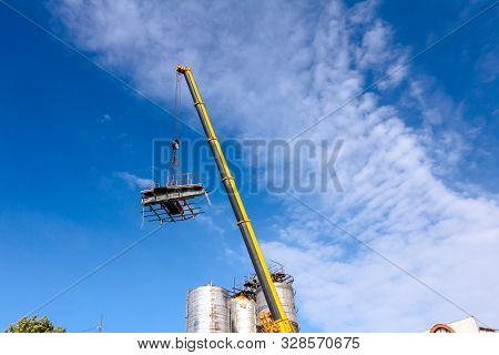 Crane Is Bringing Down Part Of Heavy Metal Construction In Industrial Complex.