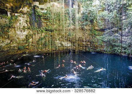 Chichen Itza, Mexico - September 12, 2019: Tourists In The Cenote Of Ik Kil