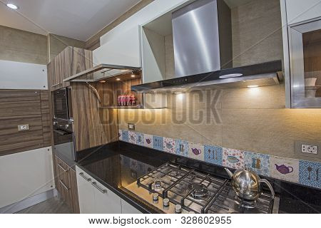 Interior Design Decor Showing Modern Kitchen Cooker Hob Appliance With Extractor Fan In Luxury Apart