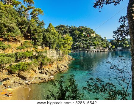 The Sand Beach Known As Paraggi Near Portofino In Genoa On A Blue Sea Background