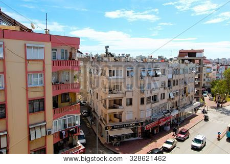 View Of The City Street. On The Roof There Are Solar Panels, Tanks For Heating Water. Antalya, Turke
