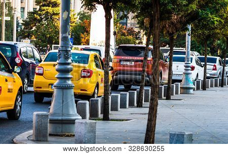 Car Traffic At Rush Hour In Downtown Area, Victoriei Boulevard (calea Victoriei) In Bucharest, Roman