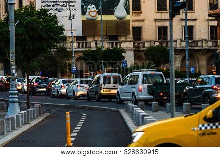 Car Traffic At Rush Hour In Downtown Area, Victoriei Boulevard (calea Victoriei) In Bucharest, Roman