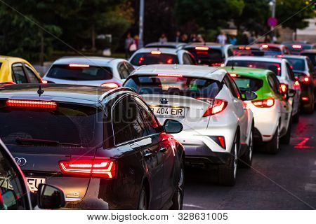Car Traffic At Rush Hour In Downtown Area, Victoriei Boulevard (calea Victoriei) In Bucharest, Roman
