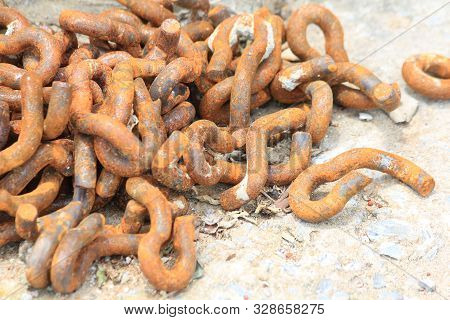 The Chain Is Very Old, Rust-eaten, Laid On The Ground.