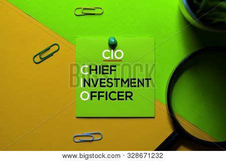 Cio. Chief Investment Officer Acronym On Sticky Notes. Office Desk Background