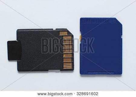 Micro Sd Memory Card With Adapter And Mini Sd On White Background Close Up