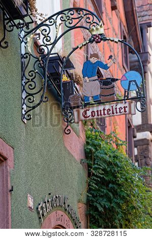 Riquewihr, France, October 13, 2019 : Old Workshop Sign. The Village Is A Popular Tourist Attraction