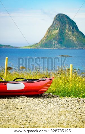 Seascape, Sea Coast With Red Canoe Kayak On Shore, Resort Bleik Andoya Norway. Vesteralen Archipelag