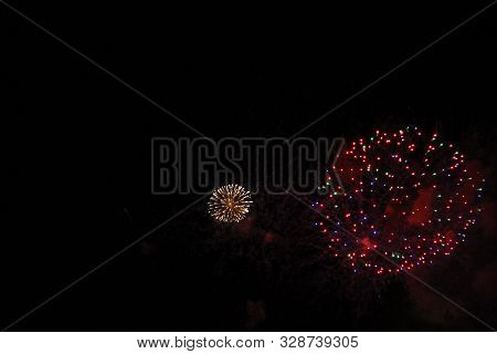The Celebration Multicolored Firework Flashing In The Black Night Sky Background