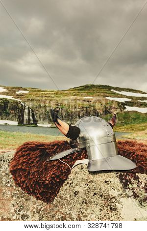 Viking Helmet On Lake Shore In Norway. Tourism And Traveling Concept