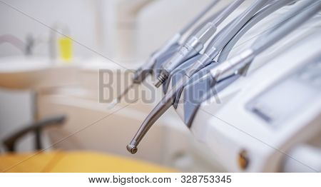 Closeup Of A Set Of Dental Burrs And Drill